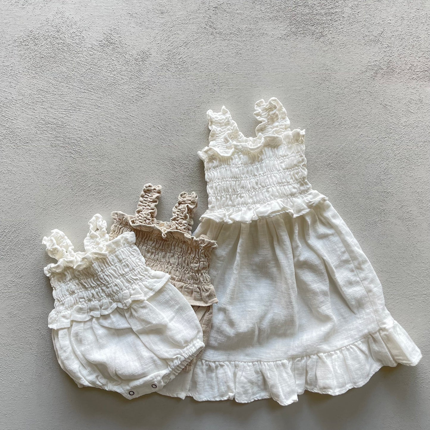 
                  
                    angel linen babysuit
                  
                